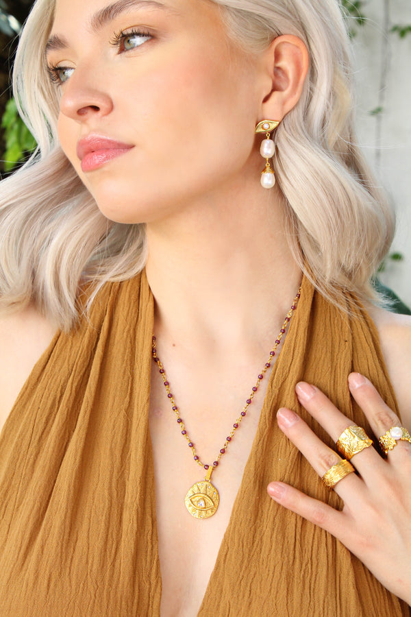 Aretes Ojo Estrella Impar Perlas