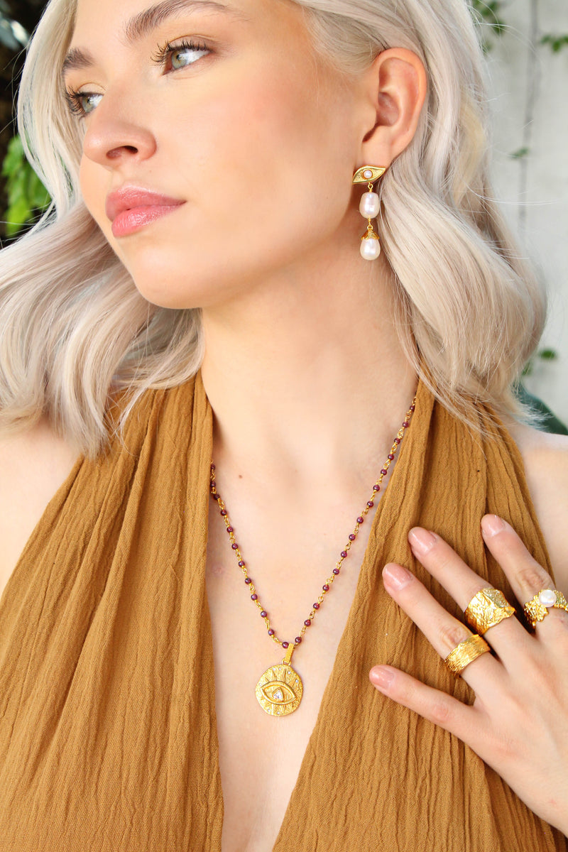 Aretes Ojo Estrella Impar Perlas